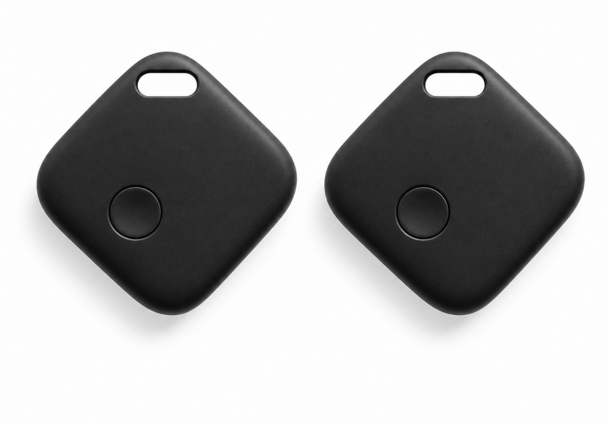 Two black square key finder tags with rounded corners and a small circular button on each, shown on a clean white background.