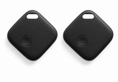 Two black square key finder tags with rounded corners and a small circular button on each, shown on a clean white background.