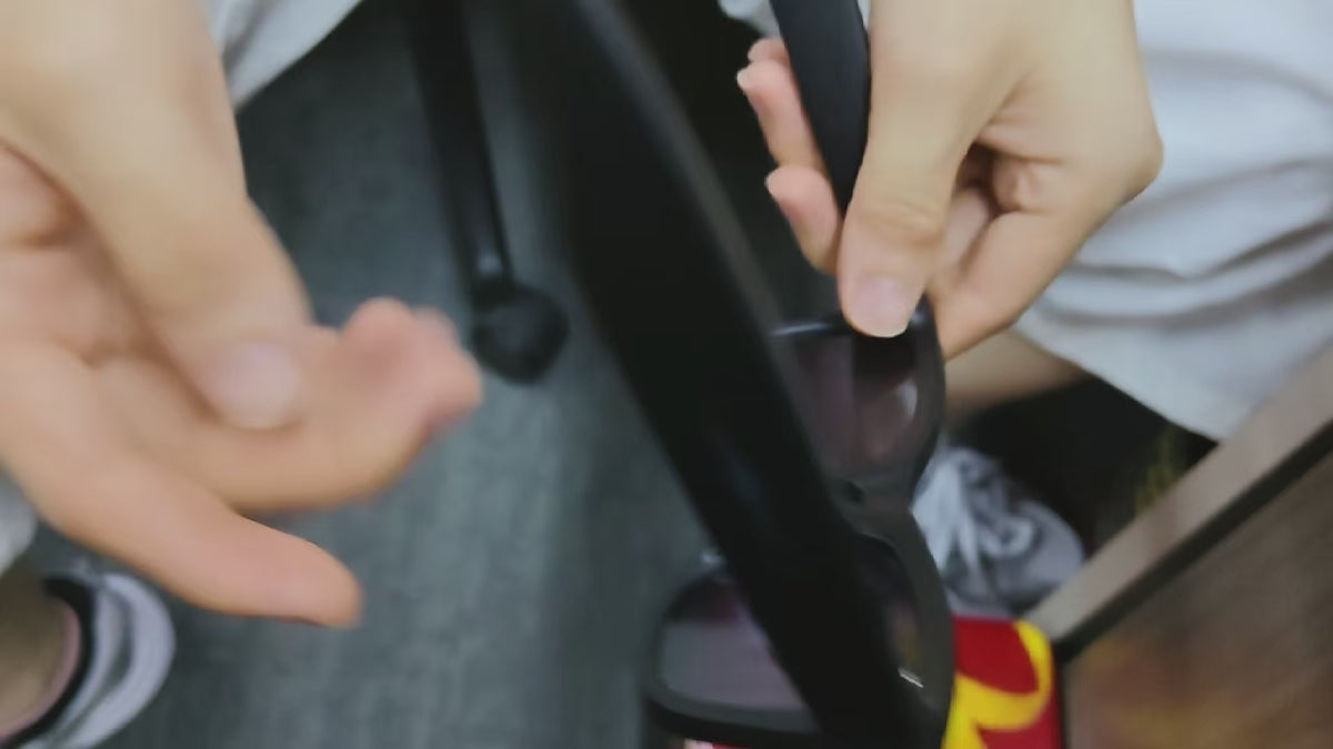 Supplier demonstration showing how to remove and refit lenses in black GS4 Max smart glasses.