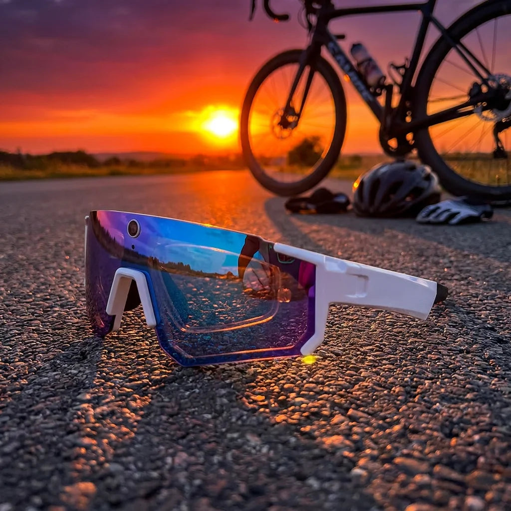 White and ice blue SOLIS sports camera glasses beside a bicycle at sunset.